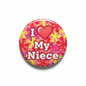 Colorful circular pinback button with pink heart and 'I My Niece' text