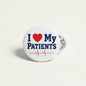 Round white pinback button with blue I heart My PATIENTS text, red heart, silver pin back