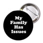 Round black pinback button with white text "My Family Has Issues" and silver backing