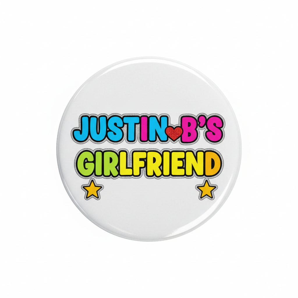 Justin B's Girlfriend round enamel pin with colorful text and star icons
