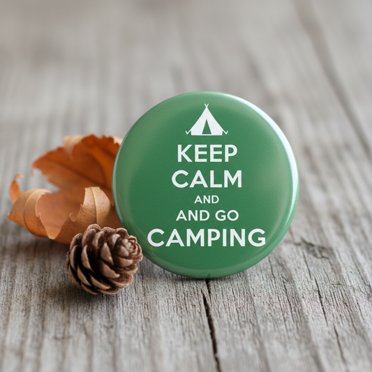 Green round pinback button with white tent icon and text "KEEP CALM AND GO CAMPING"