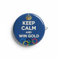 Blue round pinback button with crown, "KEEP CALM AND WIN GOLD" and Olympic rings