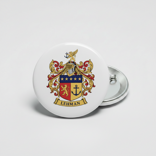 Round family crest pinback button with metal clasp; gold, red, and blue coat of arms