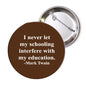 1.25-inch pinback button with brown background and white Mark Twain quote text