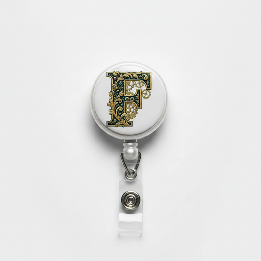 Retractable badge reel with ornate F felt face and clear badge holder clip