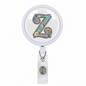 Retractable badge reel with light purple round housing, colorful letter Z graphic