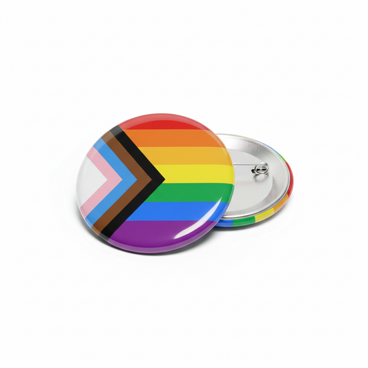 Rainbow progress flag pinback button with black chevron, silver metal backing