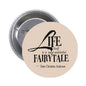 1.25-inch pinback button with beige face and black fairy-tale quote text