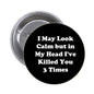 1.25-inch round black pinback button with white quote text and metal back