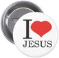 Round pinback button with “I ❤ JESUS” text and a red heart