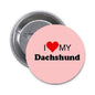 Round pinback button with pink face, "I ♥ My Dachshund" text, silver metal rim