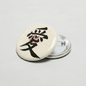 Round pinback button with black Chinese-style love letters on light background