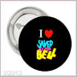 Round black pinback button with "I ♥ SAVED BY THE BELL" text in multicolor