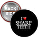 Black pinback button: 'I ♥ SHARP TEETH' lettering