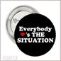 1.25-inch black pinback button: 'Everybody is THE SITUATION' with red heart