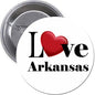 Round pinback button with white face, red heart, and black I Love Arkansas text