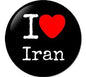 2.25-inch round black pinback button with white 'I' and 'Iran' text and red heart