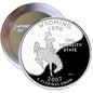 Wyoming state quarter pinback badge, round silver with Wyoming outline and “The Equality State” text