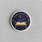 Magical Book Club pinback button, navy round enamel with open book and crescent moons