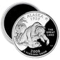Round Alaska state quarter mint magnet with grizzly bear and mountain design