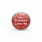 Round red pinback button with “My Grandma Loves Me” text and small heart graphics