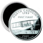 Round North Carolina quarter-style magnet with 2001 First Flight design and airplane