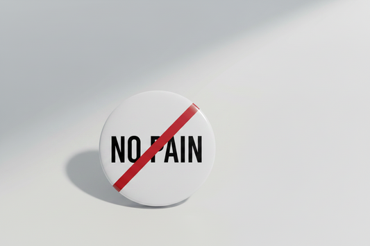 White button with black text NO PAIN and a red line through it