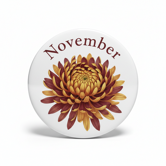 Round pinback badge with 'November' text and stylized autumn flower on white background