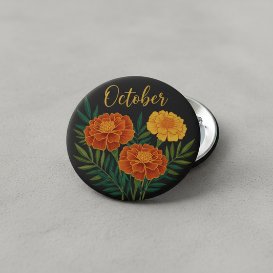 2.25-inch October flower pinback button, black with gold 'October' and orange blooms