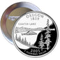 Round Oregon 1859 pinback button with Crater Lake mountain and pine tree scene, 2005