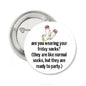 Round pinback button with white sock graphic and text 'ready to party'.