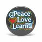 Peace Love Learn pinback button with peace sign, heart, and book icon on dark circle
