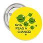 1.25-inch yellow Give Peas a Chance pinback button with smiling green peas graphic