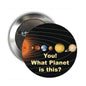Planet-themed circular pinback button with black graphic, colorful planets, and “What Planet is this?” text