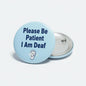 Light blue pinback button: Please Be Patient I Am Deaf, with ear icon