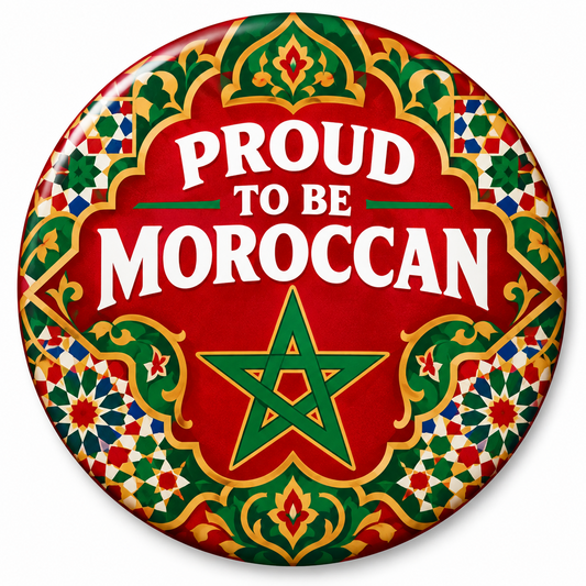 A round button badge featuring a Moroccan-themed design with the text 'PROUD TO BE MOROCCAN' in white on a red background, surrounded by a green and gold star and traditional geometric tile patterns.
