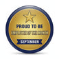 Round gold and blue pin badge with star and text: Employee of the Month, September