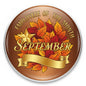 Round September employee of the month pinback with autumn leaves and gold ribbon