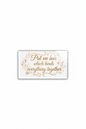 A rectangular clear acrylic block with rounded corners featuring the quote 'Put on love which binds everything together' in gold cursive, surrounded by a delicate pink floral wreath, on a plain white background.