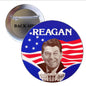 Reagan campaign pinback button with blue stars, red stripes, and Reagan portrait.