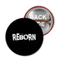 Reborn Christian pinback button, black front with REBORN text; metal back visible