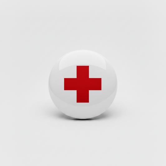 Round silver pin with a red cross on a white background