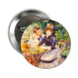 2.25-inch Pierre Auguste Renoir pinback button with two figures in garden scene