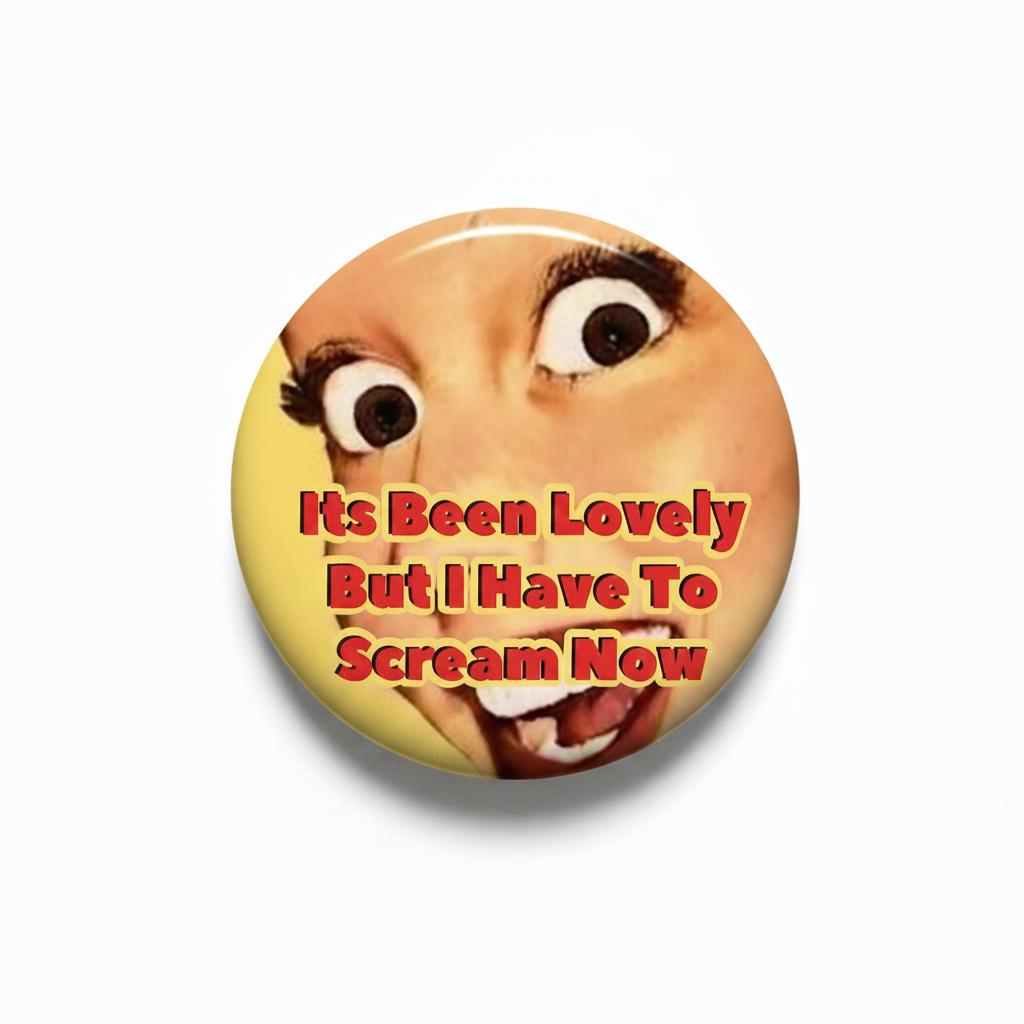 2.25-inch circular pinback button with cartoon face and red speech-bubble style text