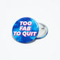 2.25-inch blue round pinback button with 'TOC FAB TO QUIT' text