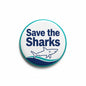 2.25-inch circular Save the Sharks pinback button with teal border and shark graphic