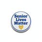 Round Senior Lives Matter pinback button with blue text and yellow heart