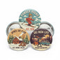 Ski-themed round pinback buttons with colorful landscape and text designs