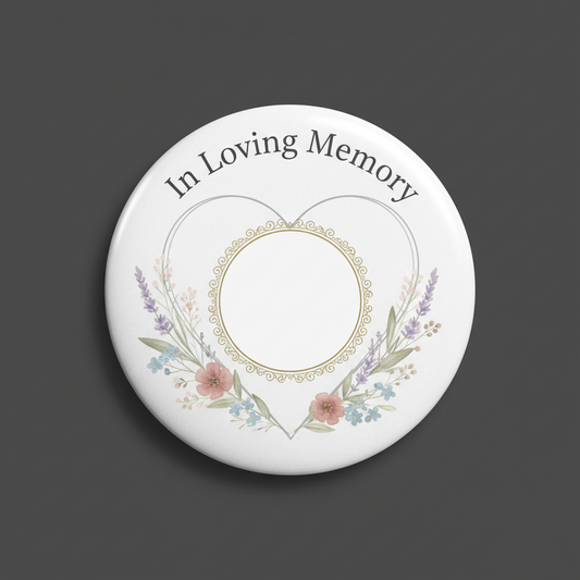 Round white memorial pinback button with floral wreath and “In Loving Memory” text