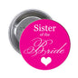 Round pink bridal pinback button reading “Sister of the Bride” with heart